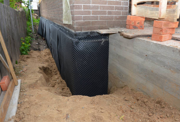 Happy homeowners after waterproofing job in Six Lakes